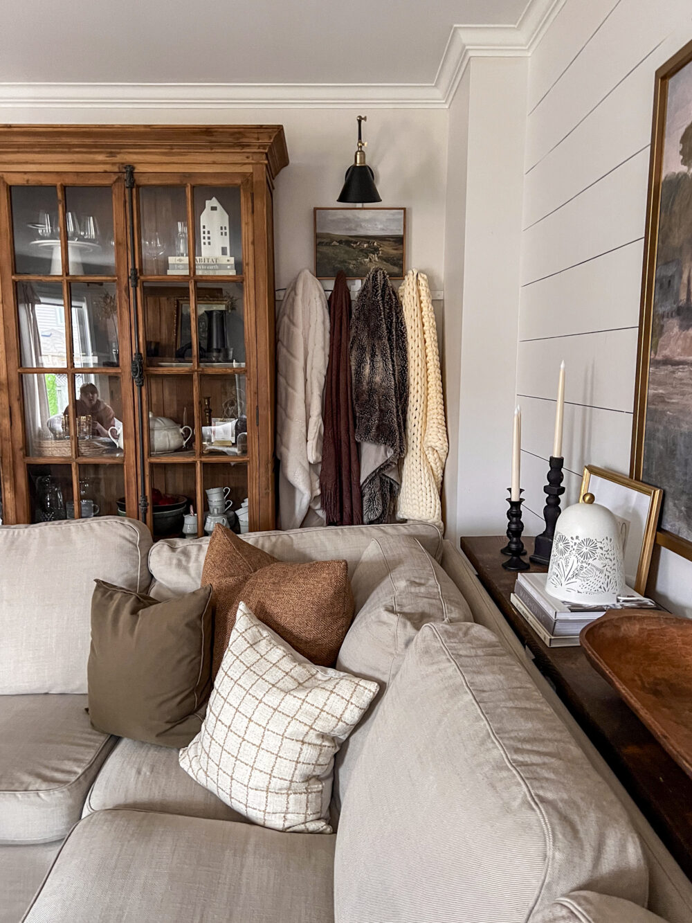 living room blanket wall behind couch