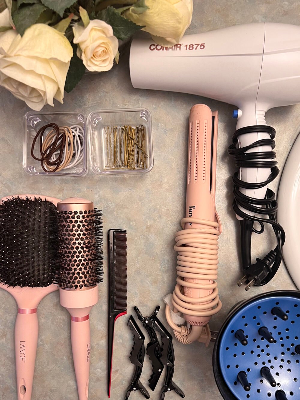 my hair tools sorted on the bathroom counter